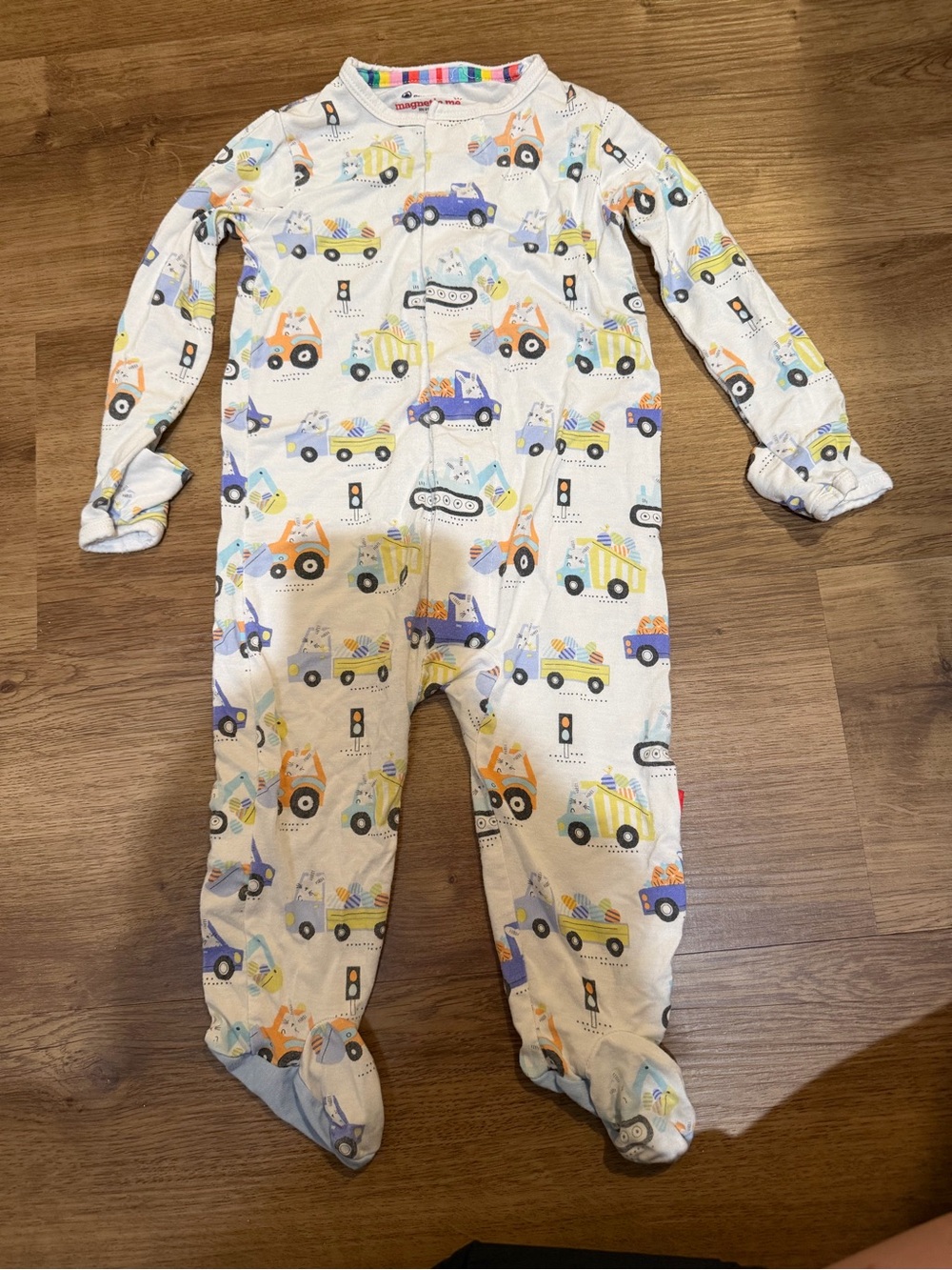 Magnetic Me White Footed One-Piece with Blue, Yellow, Orange & Black Truck Print